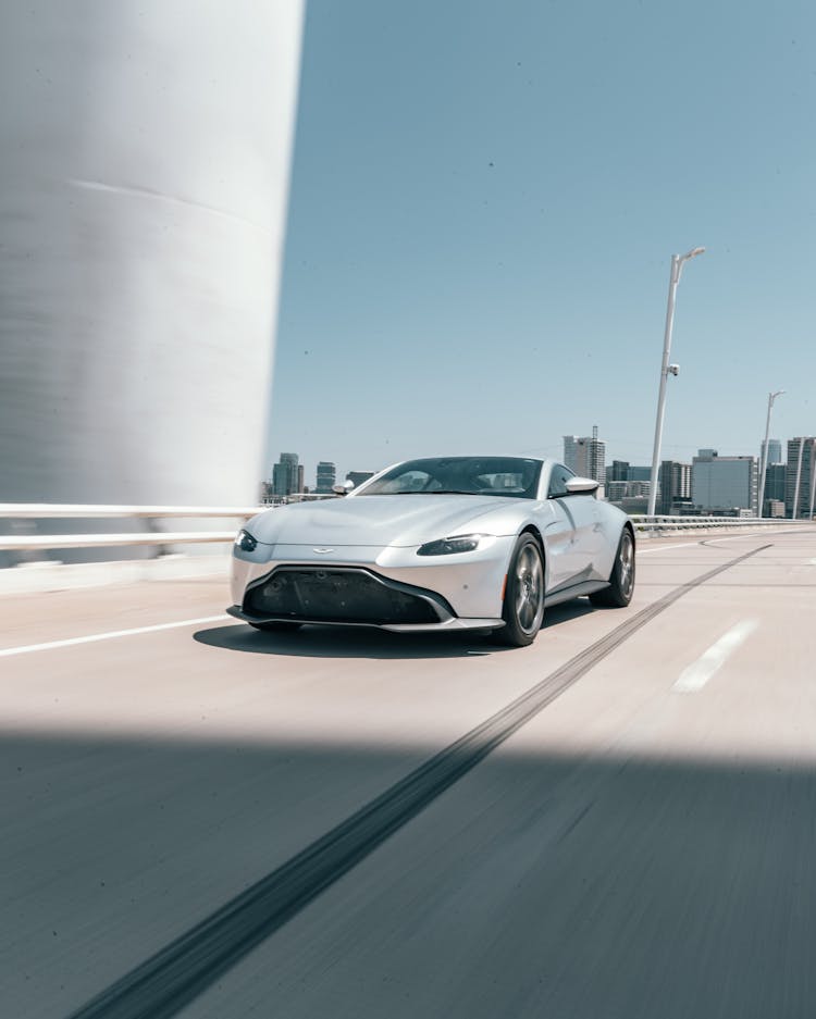 Silver Aston Martin Vantage Car On The Road 