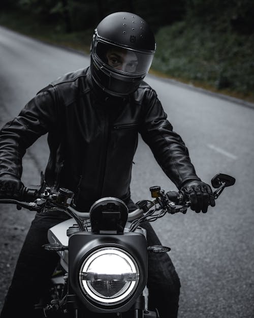 Man in Black Leather Jacket Riding Motorcycle