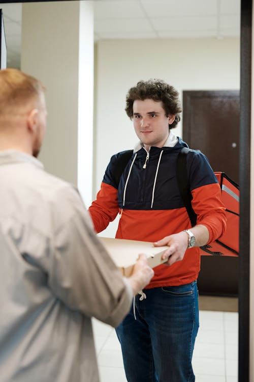 A Man Delivering a Pizza