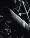 A Black Motorcycle Exhaust in Close-Up Photography