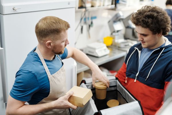 Food Service Business for Sale: Smart Guide 2026 1 Food service business for sale - cook packing a catering order