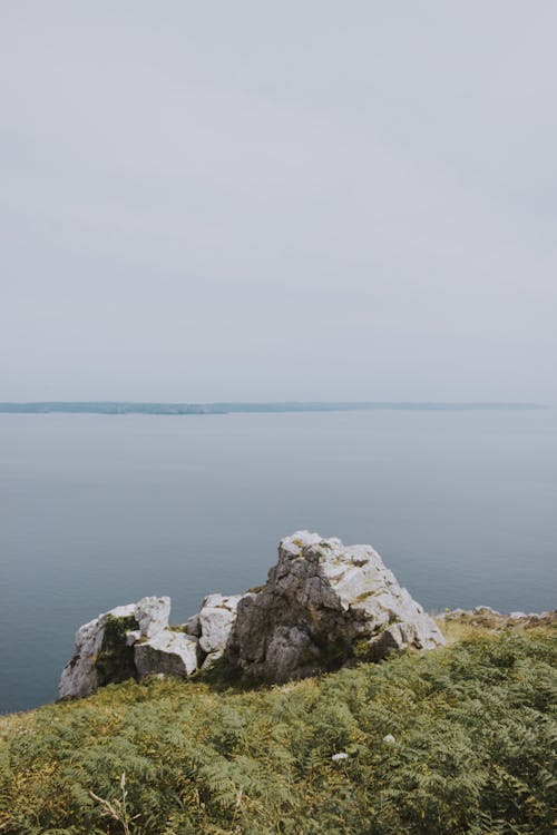 Small rocky formation on coast of reservoir