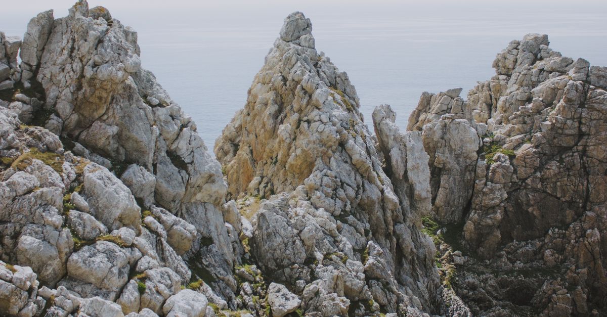 Rough Rocks Rocks Rough rocks in front of sea · Free Stock Photo