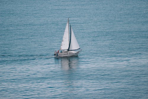 Sailboat on calm sea surface