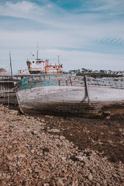 Old boat on beach near sea · Free Stock Photo