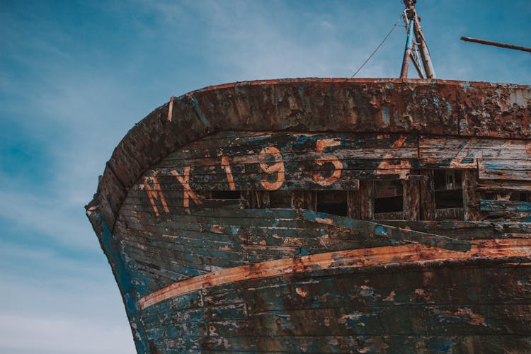 Old Wooden Boat On Shore