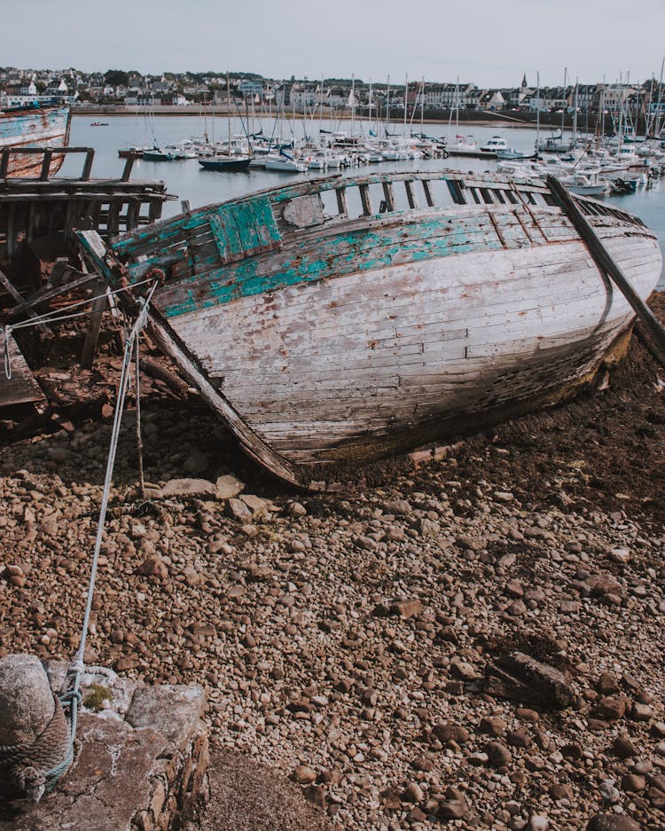 Broken Boat On Beach In Port