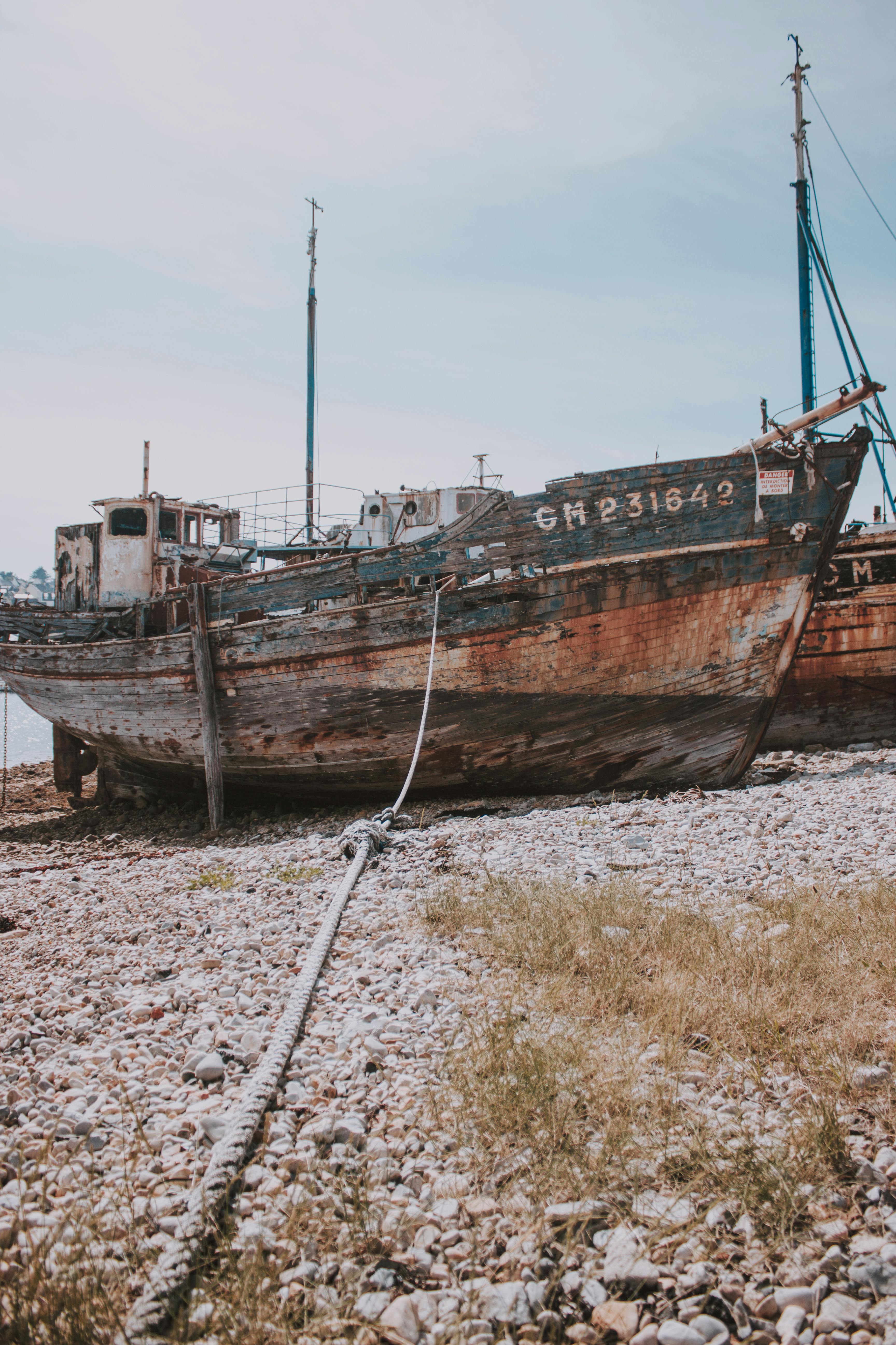 Rusty Beach Winch And Abandoned Fishing Boat High-Res Stock