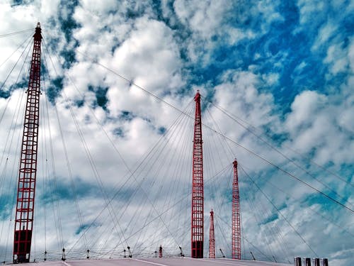 Red Power Lines Under White Clouds