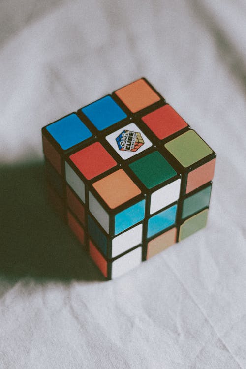 Multicolored magic cube placed on table