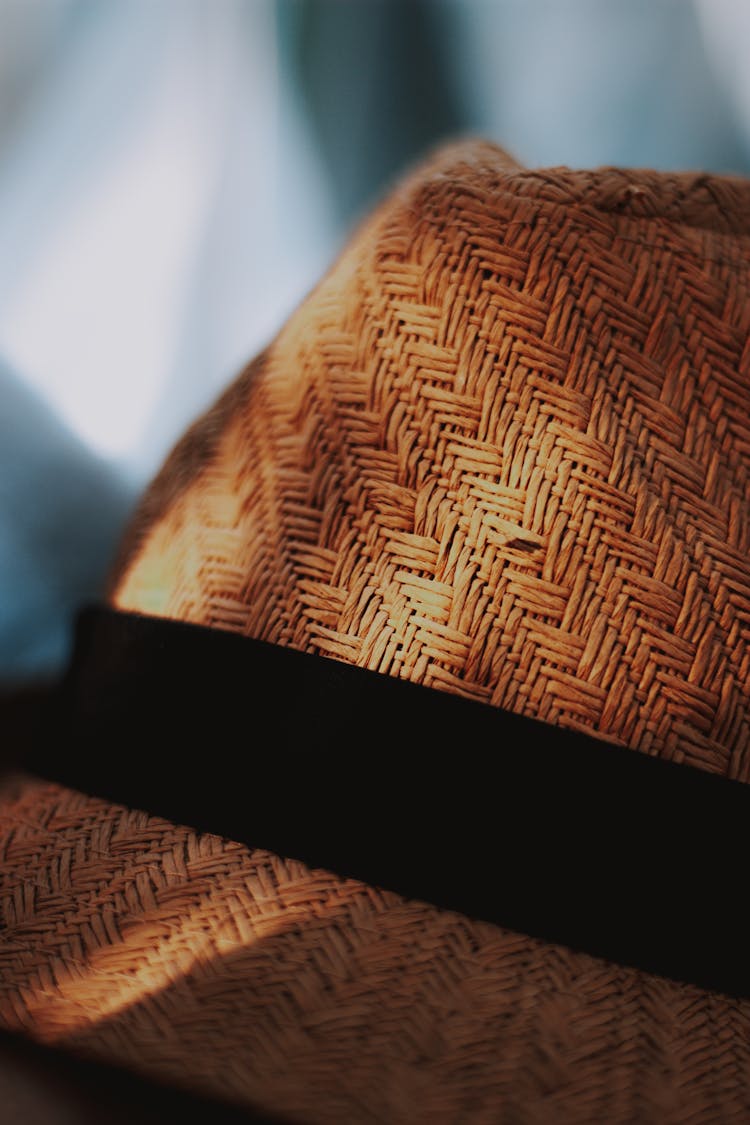 Detail Of Weaved Straw Hat With Black Ribbon