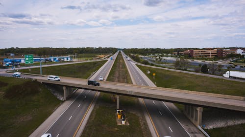 Drone view of cars riding along highway