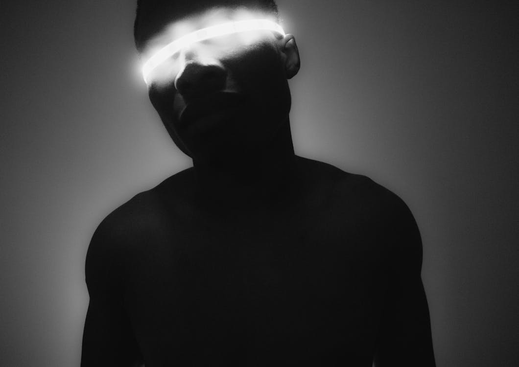 Silhouette of Person with Light Strip on Head