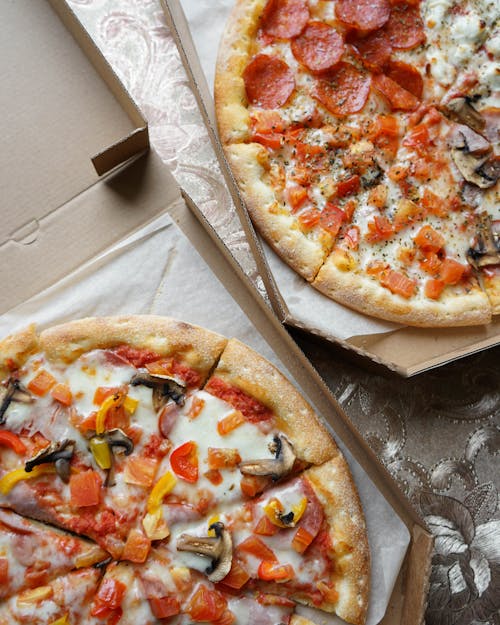 Free Takeaway boxes with bright assorted yummy pizzas Stock Photo