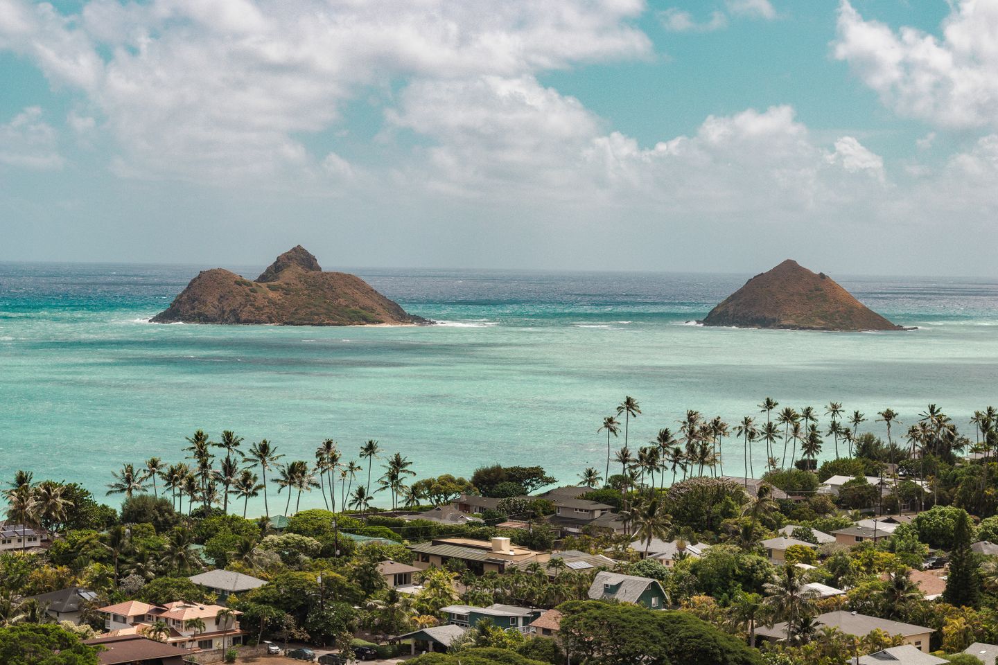 The turquoise water and offshore islets seen from Lanikai Beach on Oʻahu