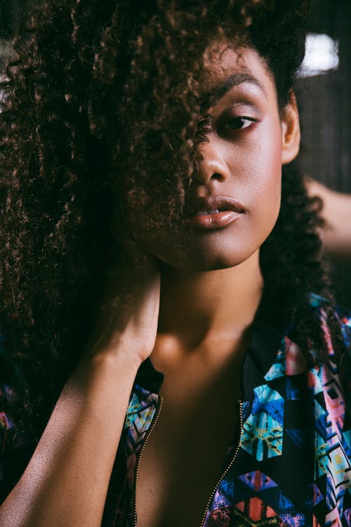 Free Crop stylish black woman with curly hair Stock Photo