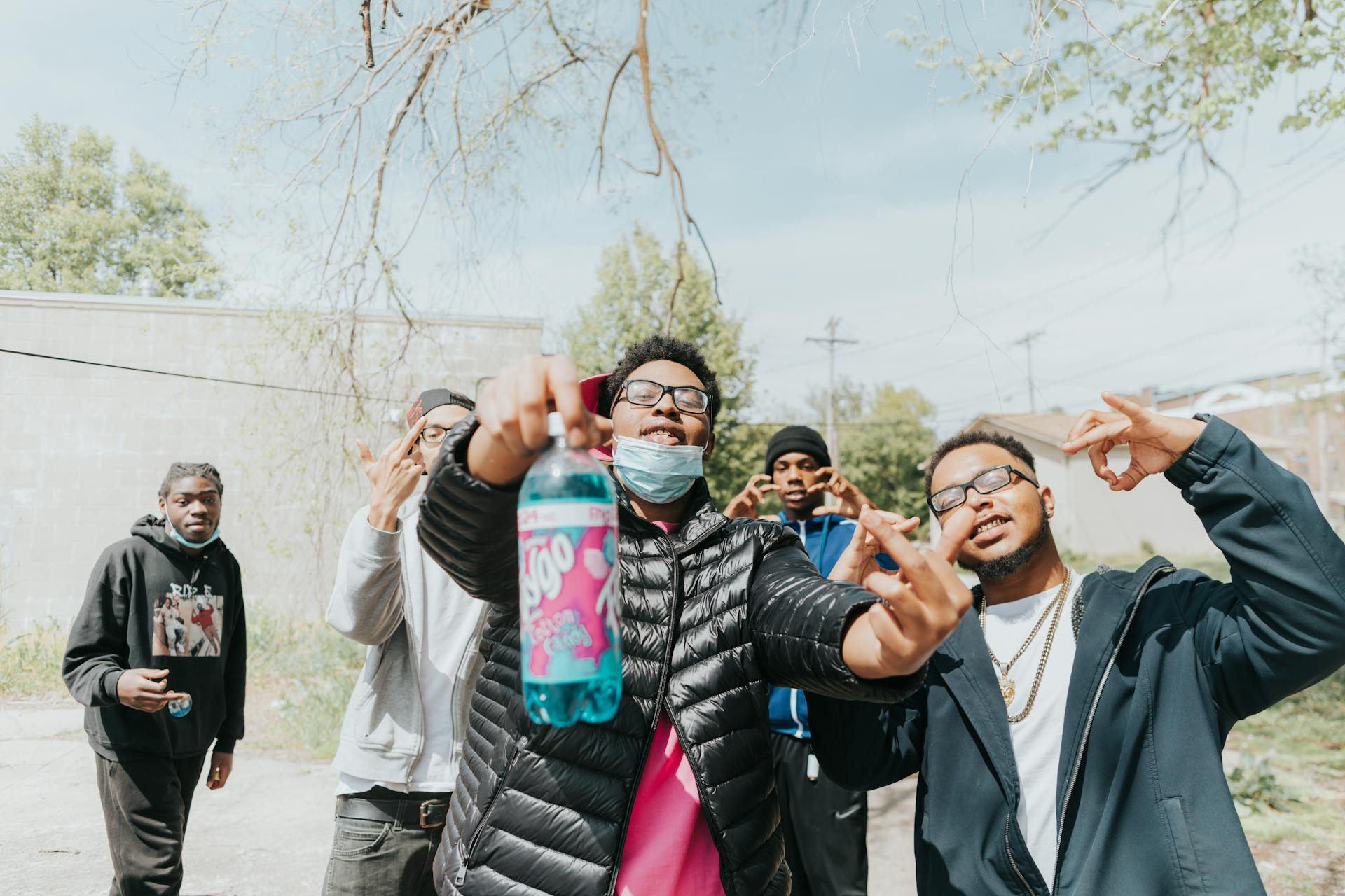 Group of Men Doing Hand Signs