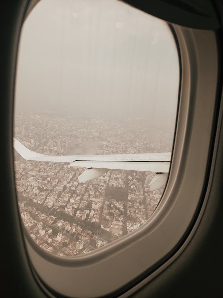 View Of Foggy Sky From An Airplane Window