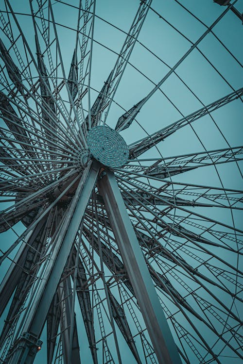 Ferris wheel with metal spokes in amusement park