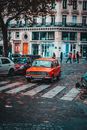 Vintage auto on road near crosswalk in city
