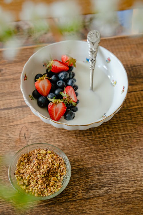 Free Bowls of Cereals and Fruit with Milk Stock Photo