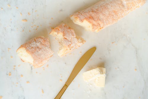 Free Bread and Butter Beside a Knife Stock Photo