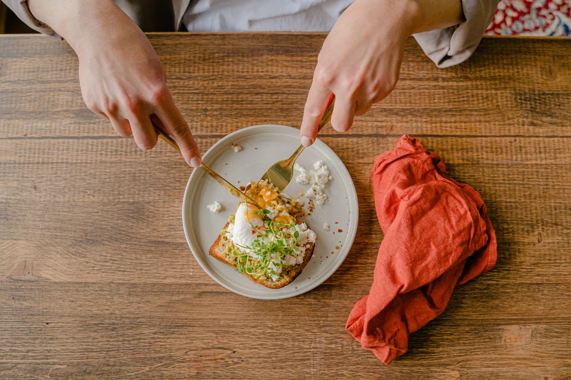 Eating A Toaster A Person Eating a Toast with Boiled Egg · Free Stock Photo