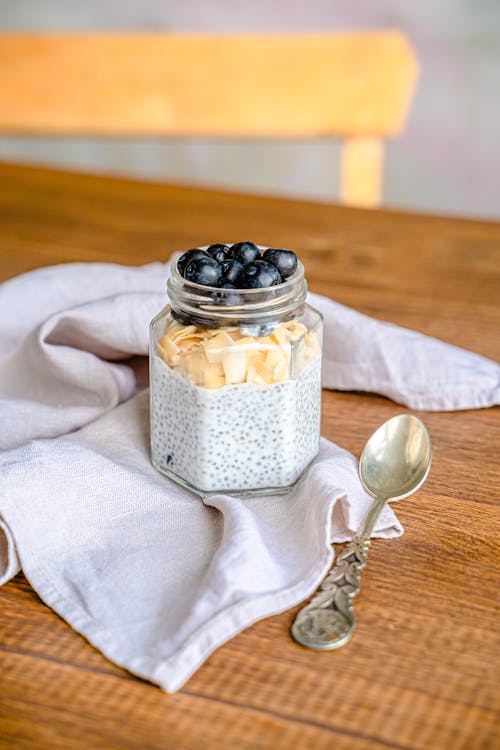 Jar with a Delicious Healthy Snack and a Spoon