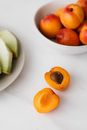 Healthy organic apricots placed on table near sliced melon