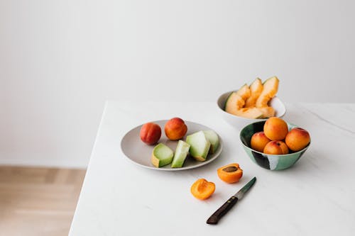 Fresh fruits placed on white table