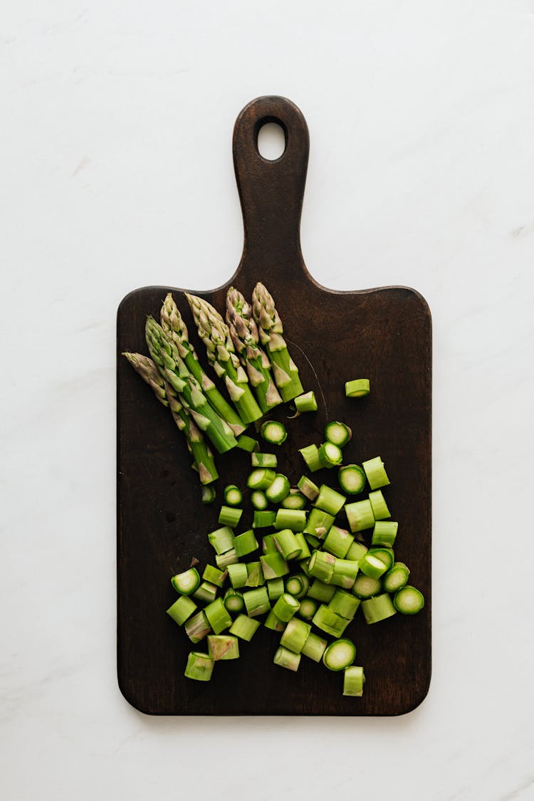 Green Vegetables On Wooden Board In Kitchen