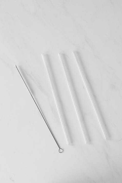 Set of tubes with brush on white background