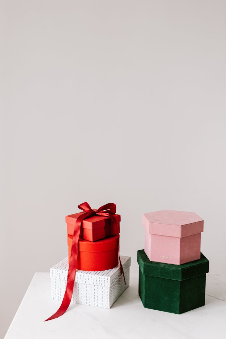 Stack Of Different Gift Boxes On White Surface 