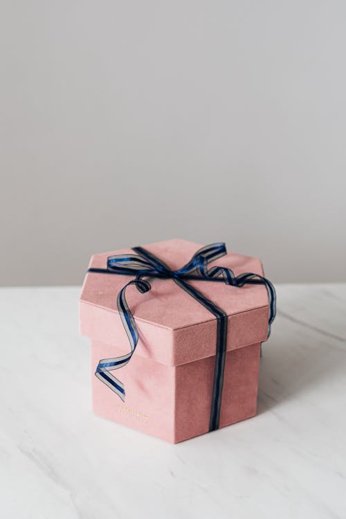 Free Gift box decorated with ribbon bow for present Stock Photo