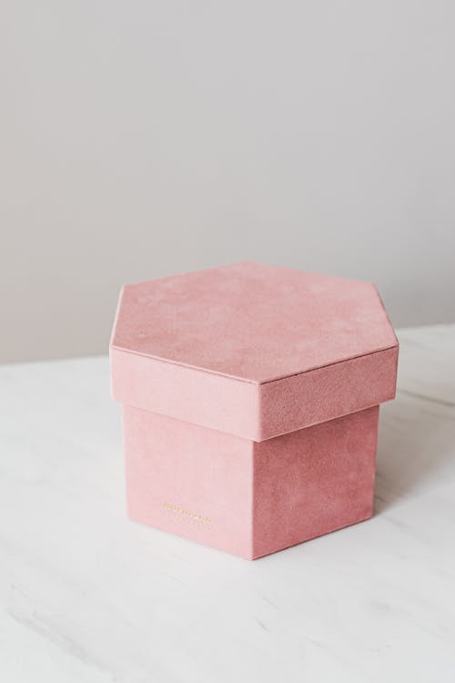 Creative pink present box on marble table