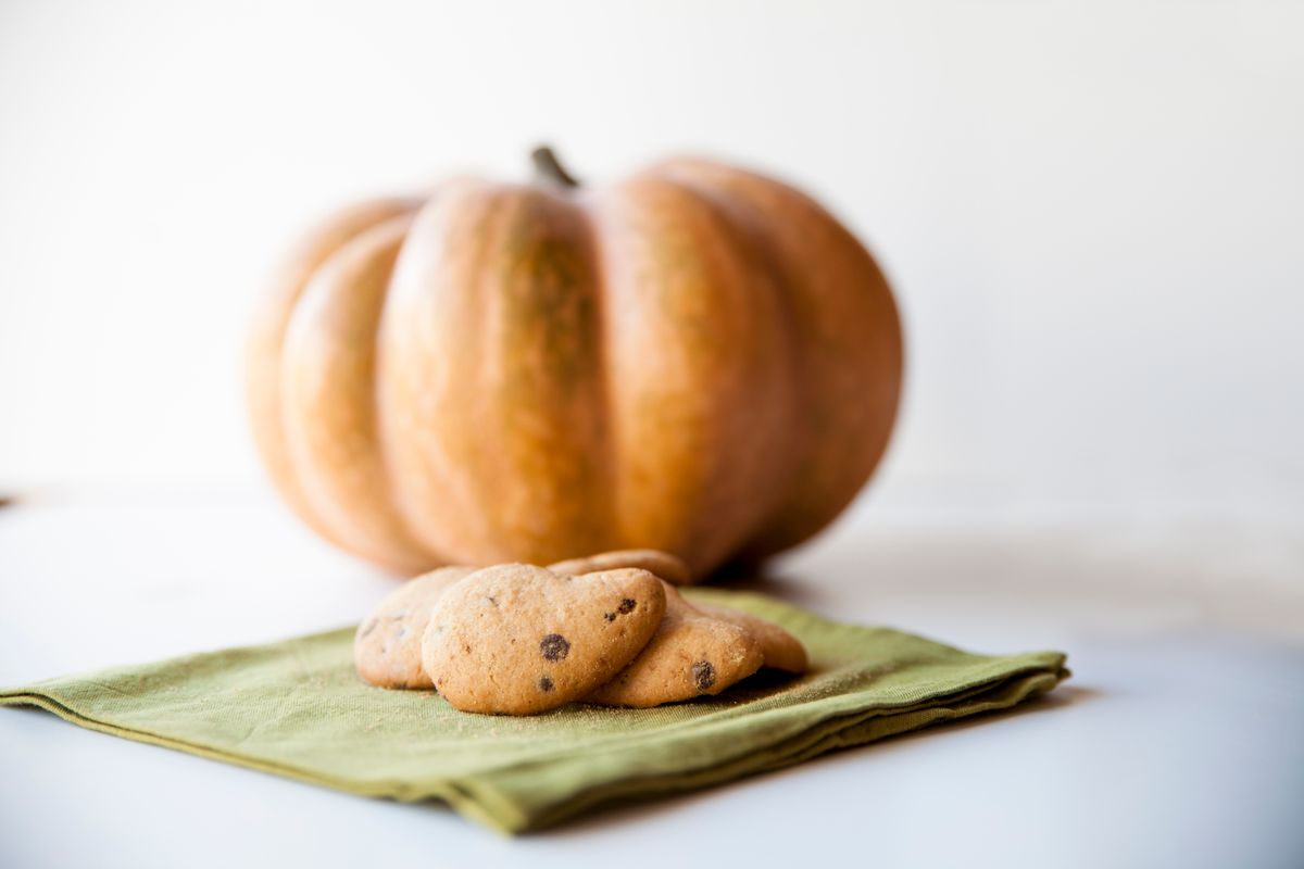 Soft homemade pumpkin cookies arranged on a green napkin