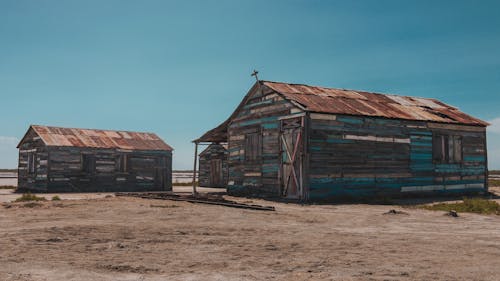 Wooden shabby abandoned barns in countryside