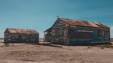 Wooden shabby abandoned barns in countryside