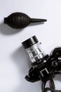 From above of stylish old fashioned photo camera placed with oil for repair