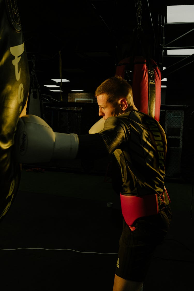 A Man Punching On Punching Bag