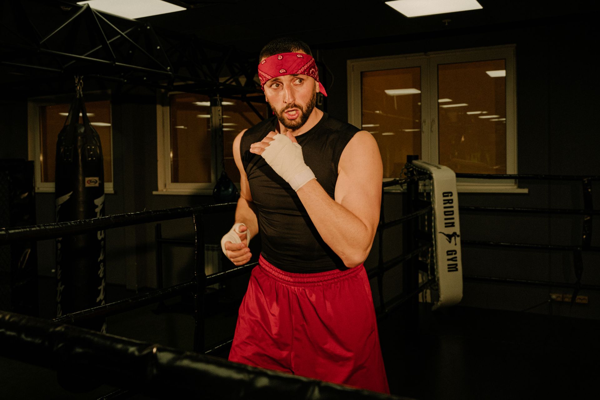 A Man Standing Inside the Boxing Ring