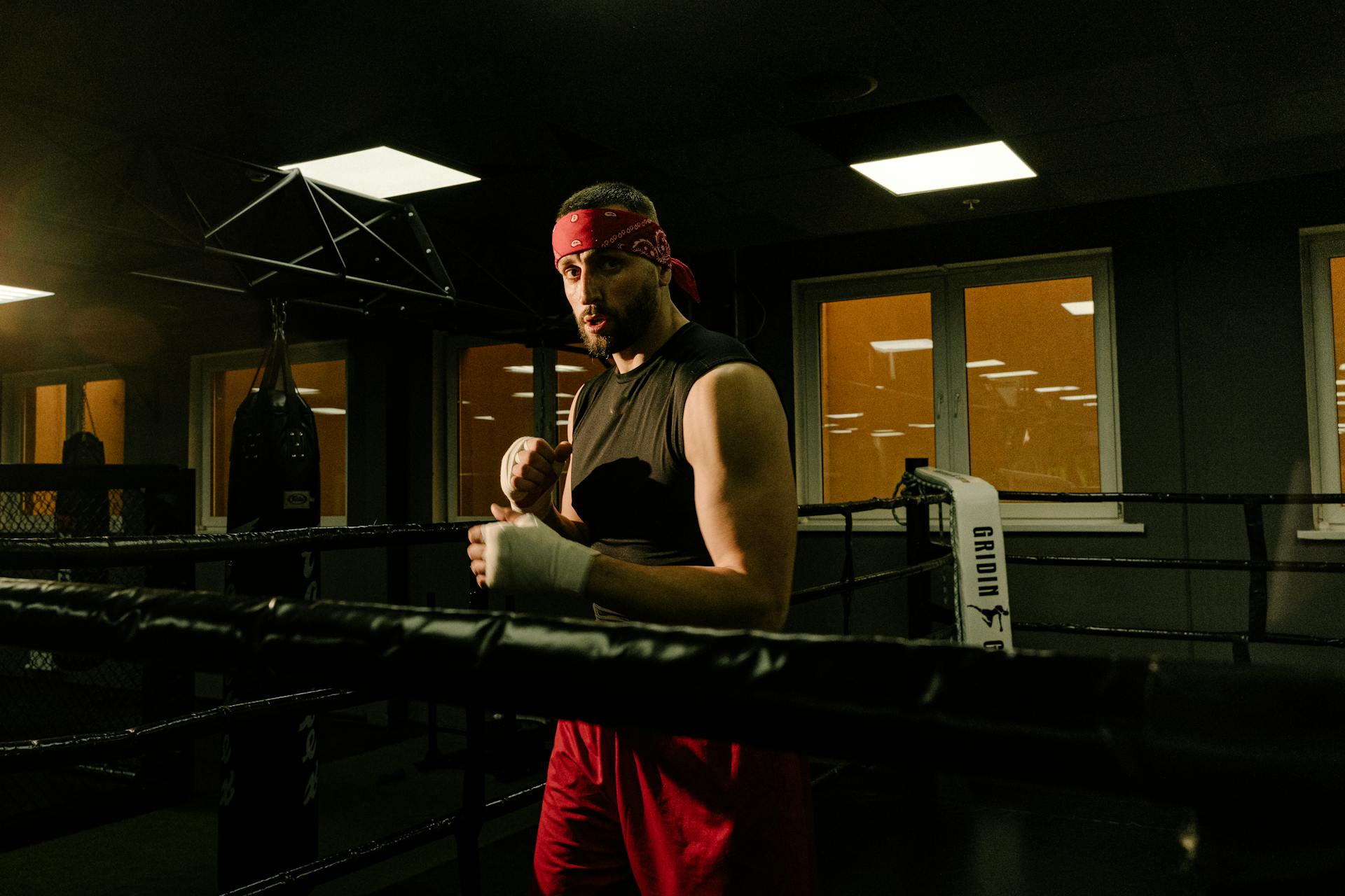 A Man Standing Inside the Boxing Ring