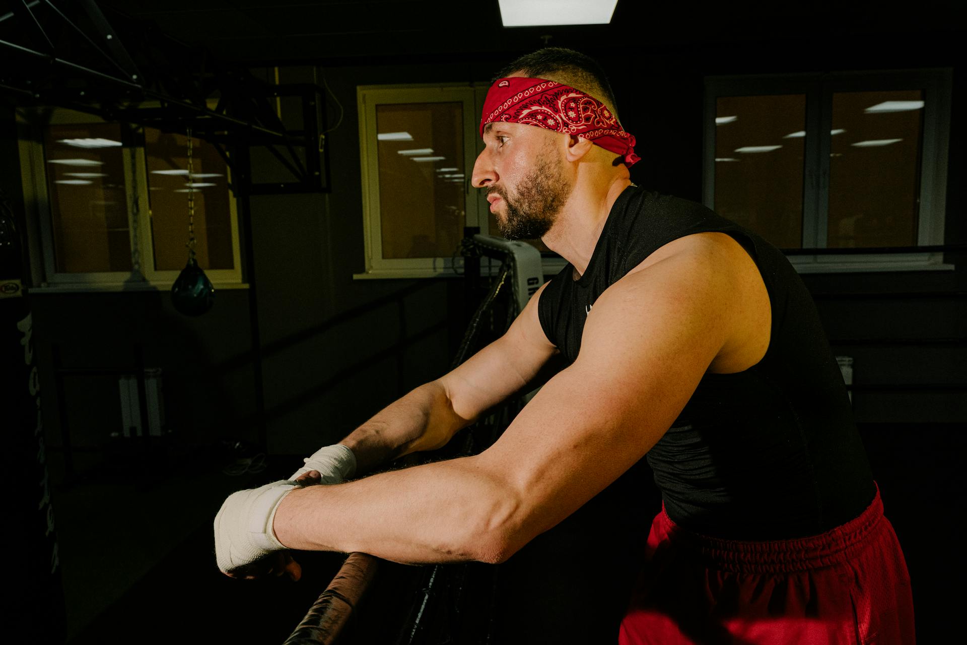 A Man in Black Tank Top Standing in Boxing Ring