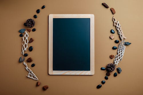 Blackboard surrounded with cones and pebbles