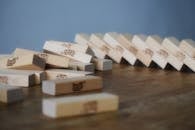 Board game with wooden blocks dropped and scattered on table chaotically after playing