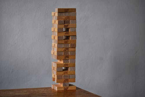 Party game with wooden blocks placed on top of each other as tower for playing