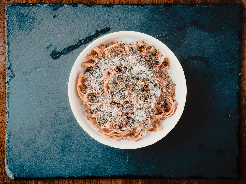Rustic buckwheat pasta with melted cheese and greens, like pizzoccheri della Valtellina