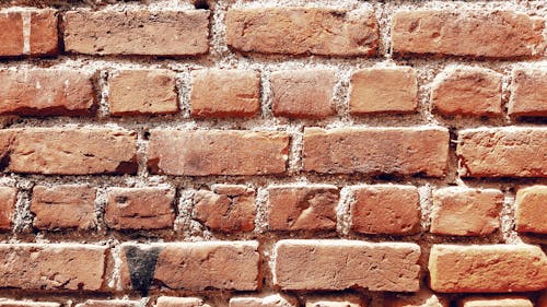 Free Rough shabby brick wall of aged building Stock Photo