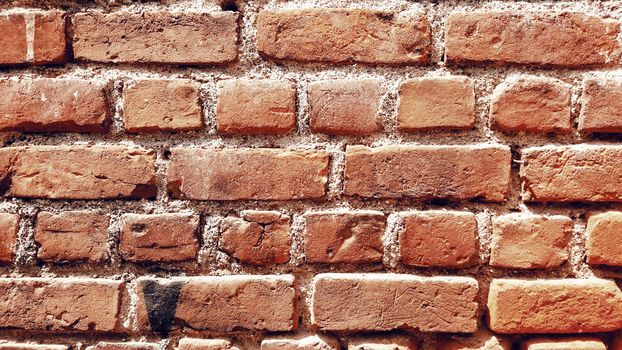 Rough shabby brick wall of aged building