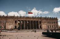 Historic Colombian National Capitol in Bogotá's Bolivar Square with waving flag.